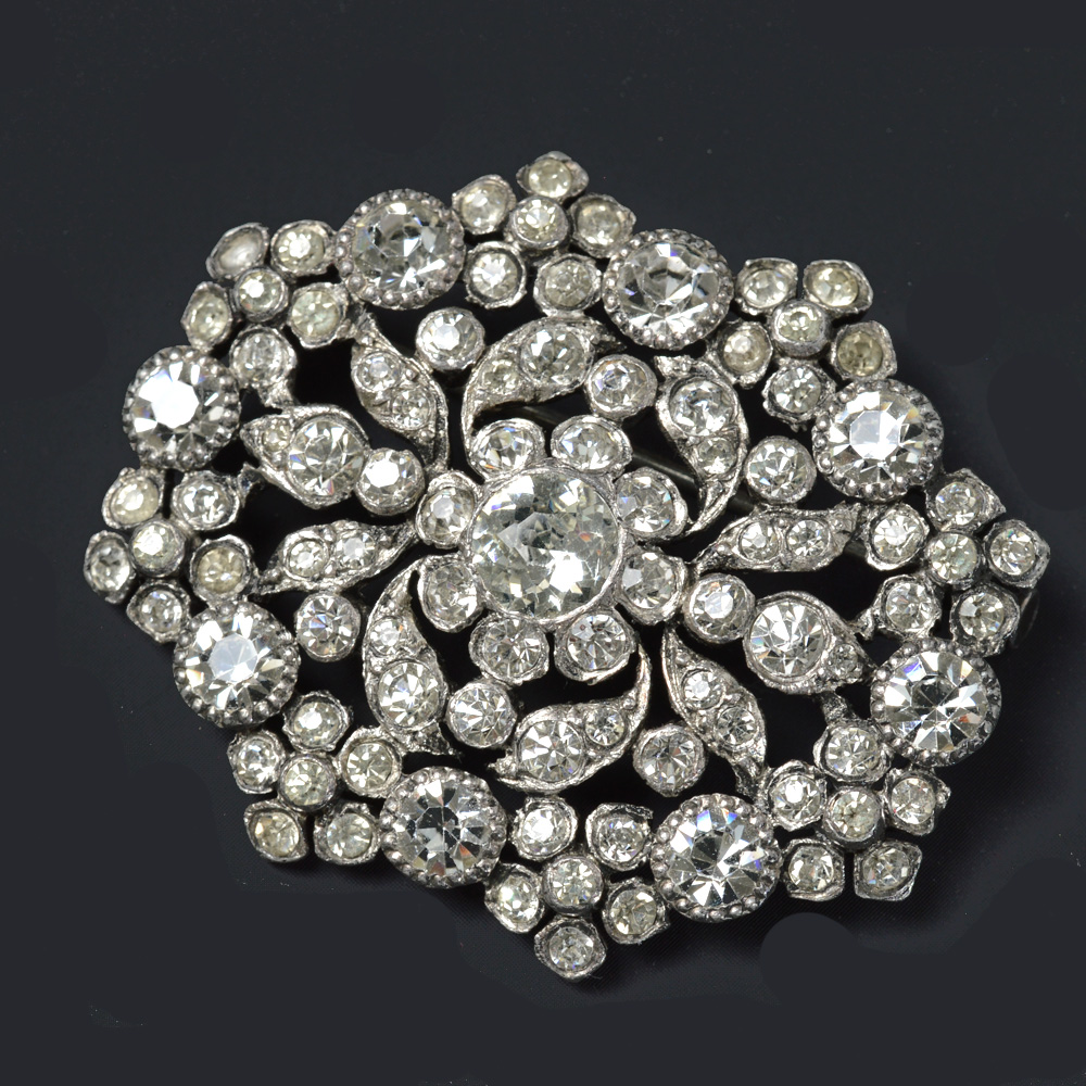 Victorian silver brooch with rhinestone floral motifs